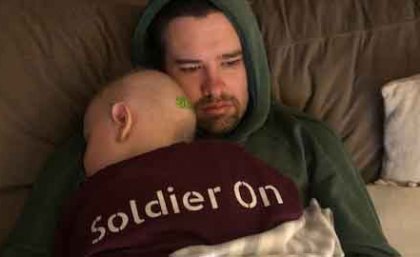 Archer while undergoing chemotherapy in 2019, with his dad. Image: Claire Bermingham.
